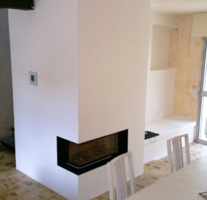 Poêle de masse Brunner - Foyer d'angle - Banquette chauffante